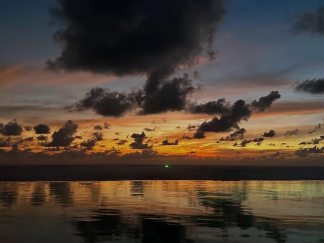 Stare at the green light, for it will draw you in like a squid to the nets. Seen over my infinity pool in Phuket. #phuket #squidboat #infinitypool #thailand #paresaresort